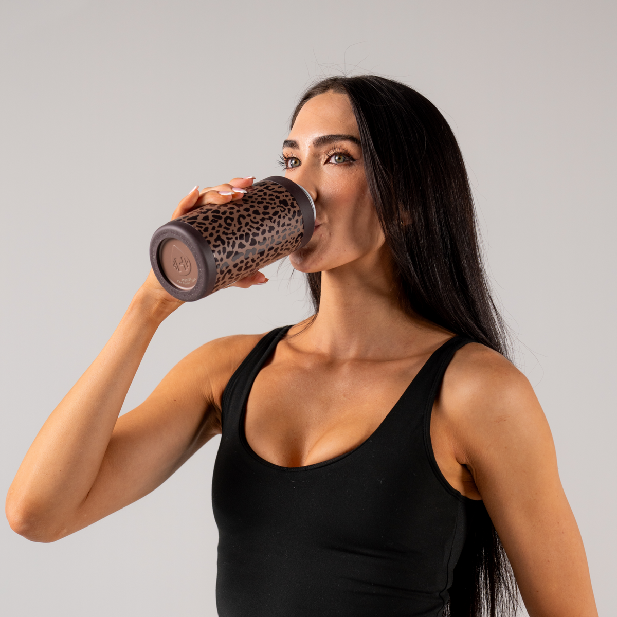 Woman Drinking from HydroJug Brown Leopard Can Cooler 16oz