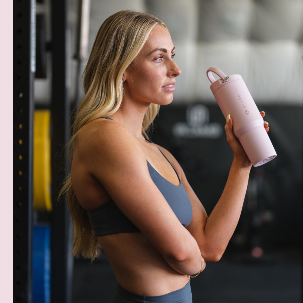 Woman Holding HydroJug Pink Sand Sport Bottle 20oz